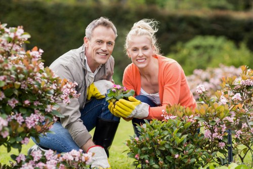 Operator using protective equipment while servicing garden machinery